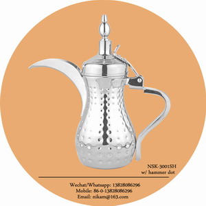 silver coffee pot with hammer dots